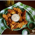 Dill Pickle Fried Chicken on a green jadeite glassware platter