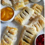 Easy 3 Ingredient fruit filled hand pies made with puff pastry and canned pie filling of your choice. Easy, delicious and kid friendly dessert.