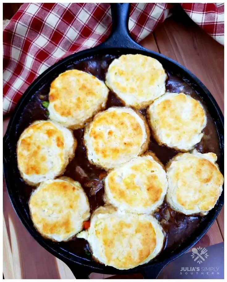 Beautiful one skillet pot pie meal, made with beef and vegetables then topped with biscuits before baking