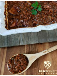 Grandma's Southern Style baked beans with molasses in a white casserole dish. This is a favorite side dish of summer and so easy to prepare.