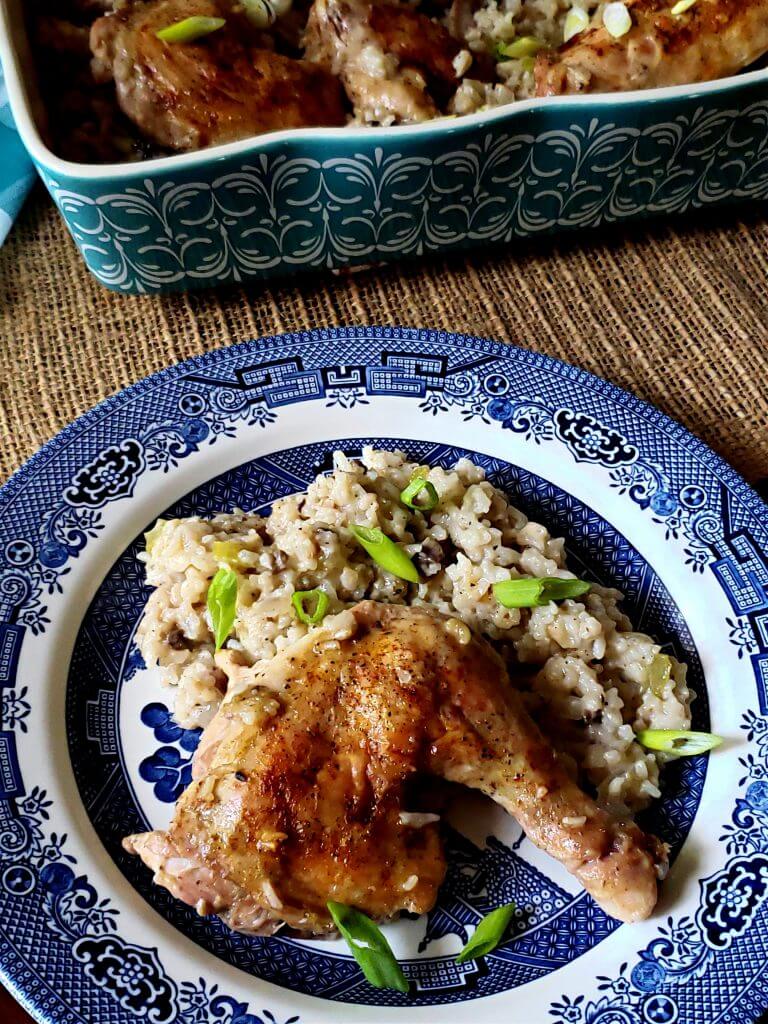 Delicious baked chicken and rice casserole serving on a Blue Willow plate