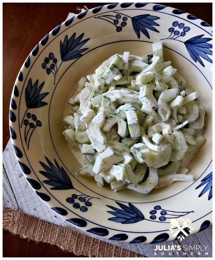 Quick and easy creamy cucumber salad with Vidalia onion and dill in a dressing of mayonnaise, sour cream and touch of buttermilk. It's tangy and delicious. The perfect cool side for summer.