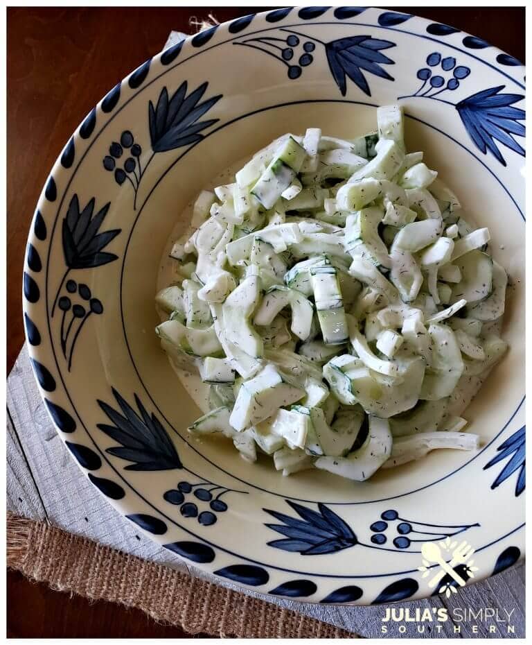 Quick and easy creamy cucumber salad with Vidalia onion and dill in a dressing of mayonnaise, sour cream and touch of buttermilk. It's tangy and delicious. The perfect cool side for summer.