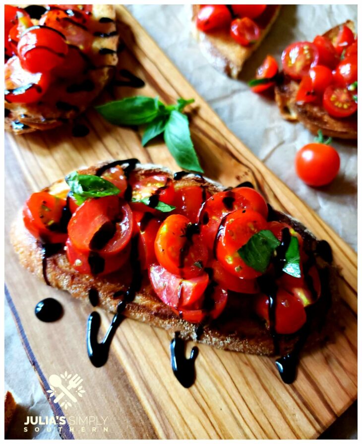 Recipe for Bruschetta made with tomatoes from the garden, herbs and garlic on toasted Italian bread with a balsamic glaze drizzle