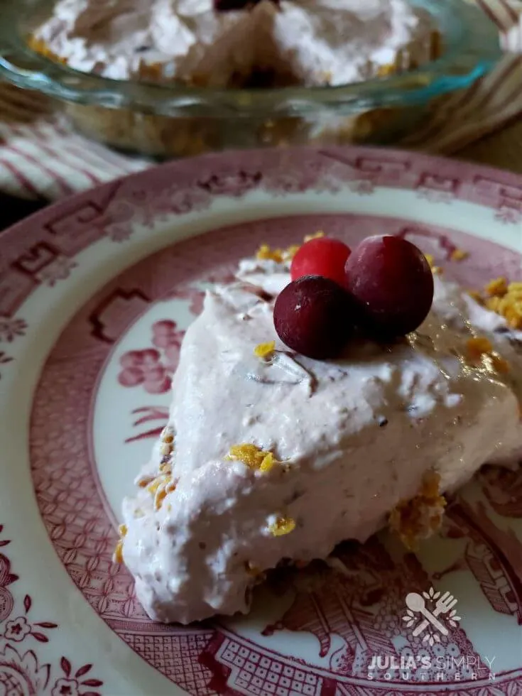 Frosty Cranberry Pie on a plate garnished with fresh cranberries