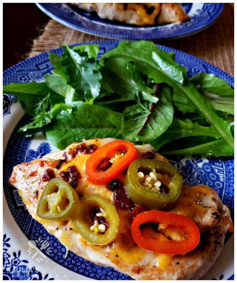 Jalapeno Popper Chicken Breast dinner with side salad on a blue and white Churchill plate