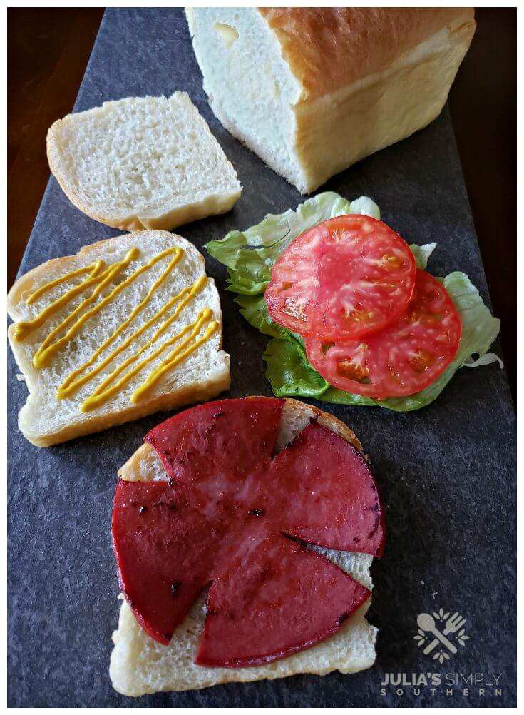 Old fashioned fried baloney sandwich on squishy white bread