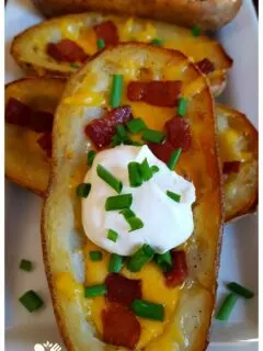 Perfect Potato Skins with crispy skin served on a white platter for game day