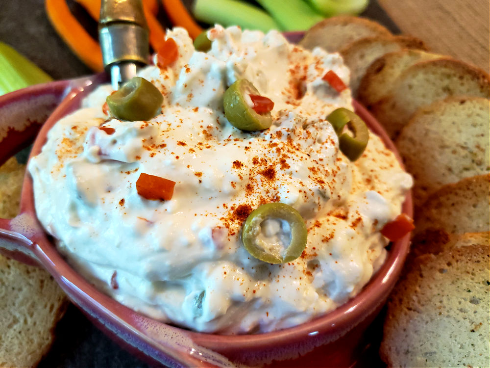 cream cheese green olive appetizer dip in a serving bowl.
No lemon juice or olive oil in recipe.