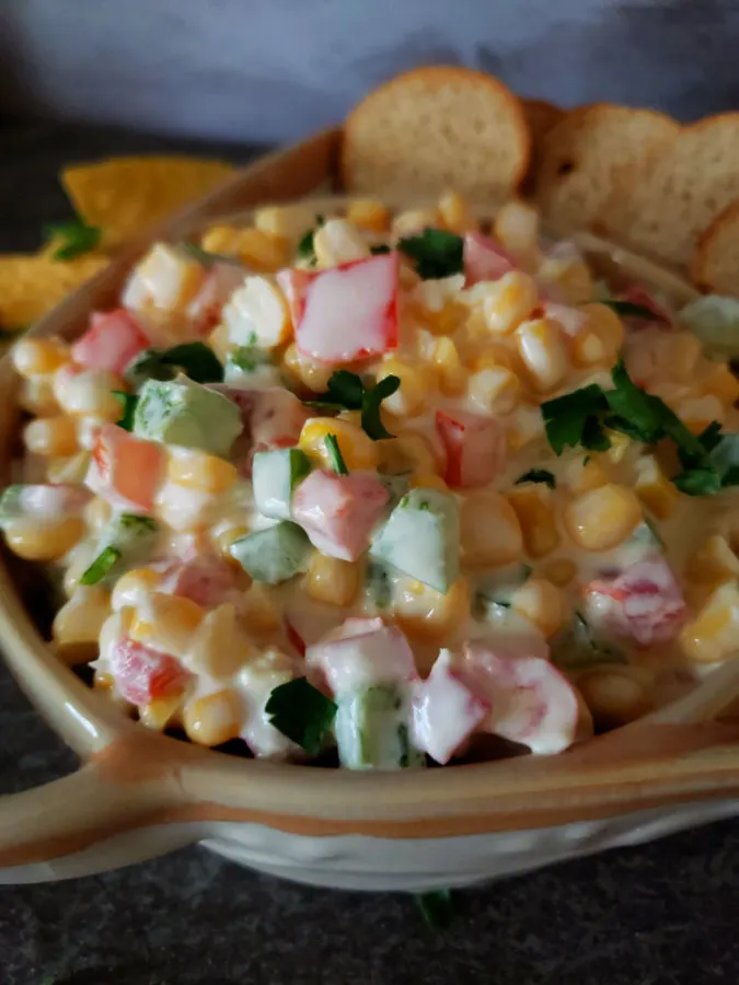 sweet corn dip with mayonnaise, cream cheese, sour cream, pimentos, bell pepper, grated onion and salt