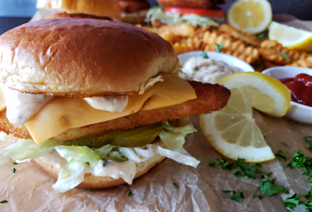 Perfect homemade fish filet sandwich restaurant copycat with fresh toppings and sides