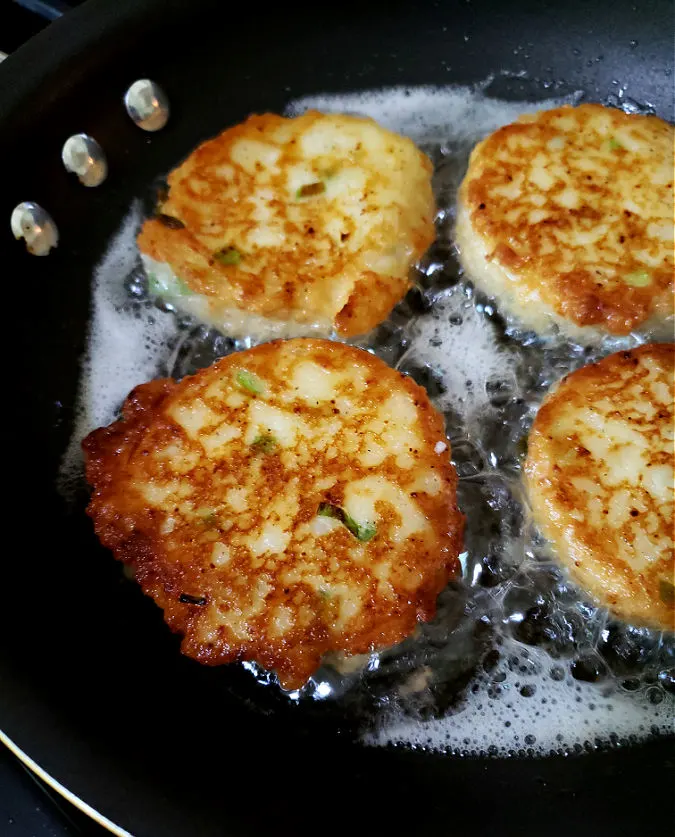 brown the potato cakes on one side then flip to cook the other side