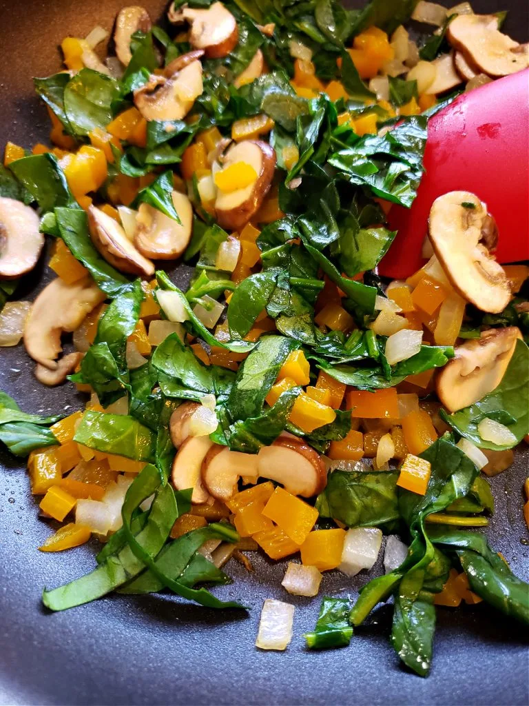 Sautéing vegetables for quiche recipe