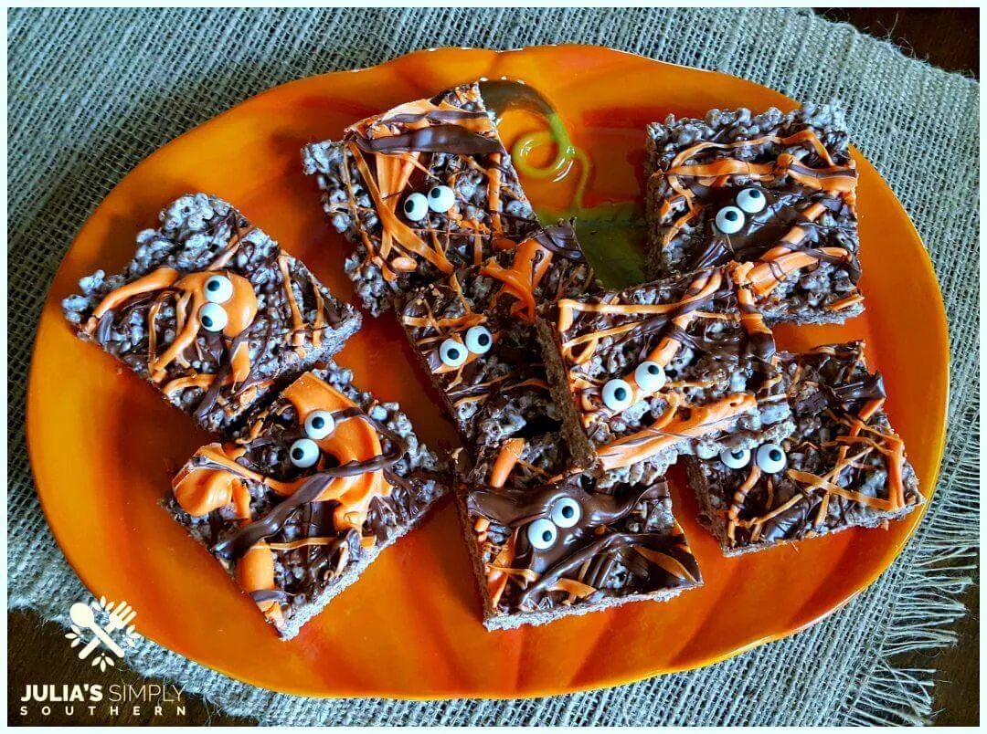 Halloween Krispie Treats on an orange pumpkin platter