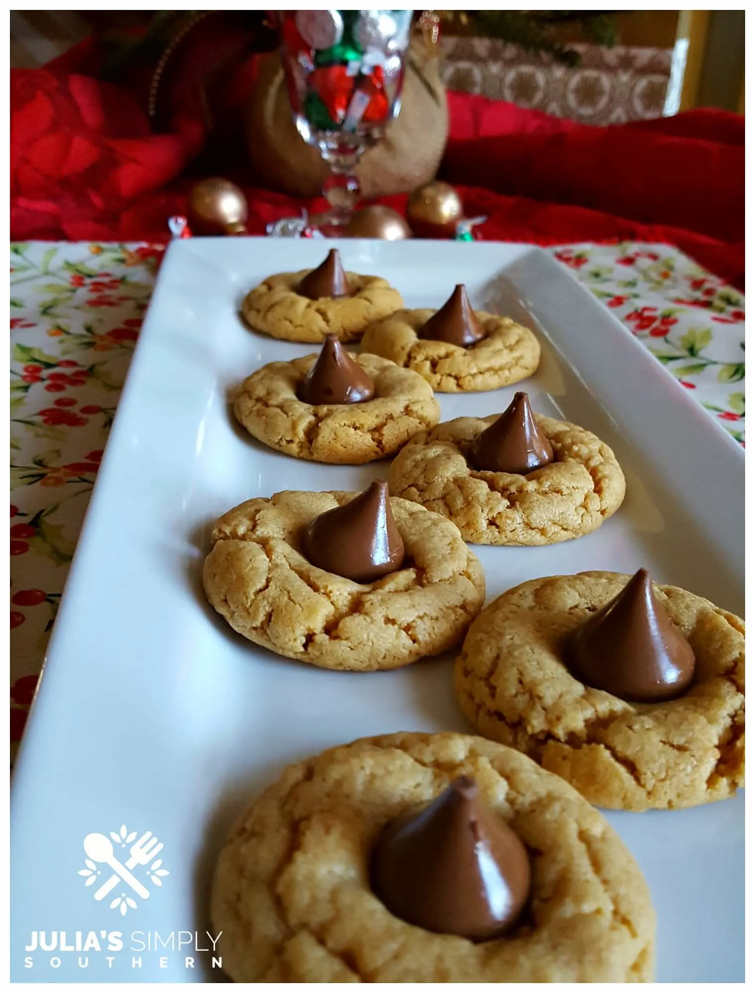 White platter with delicious Christmas cookies - peanut butter blossoms 