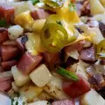 Delicious Spam Fried Potatoes with melted cheese and jalapenos