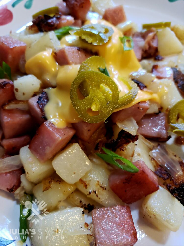 Hash style Spam Fried Potatoes with melted cheese and jalapenos