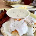 country white gravy with black pepper over a biscuit