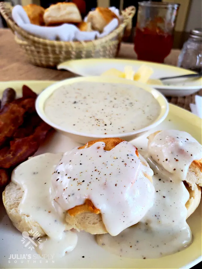 country white gravy with black pepper over a biscuit