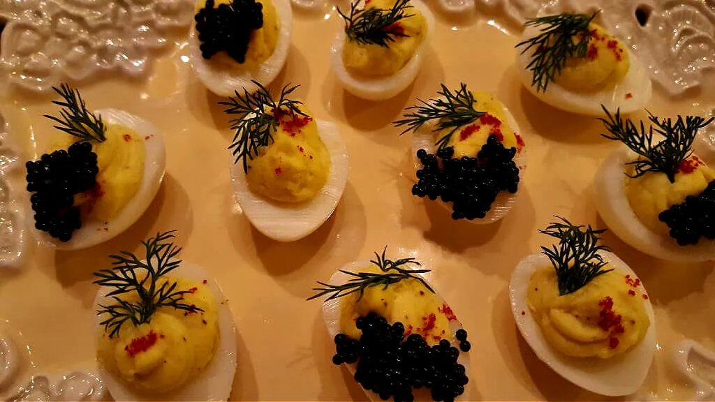deviled quail eggs on a serving platter