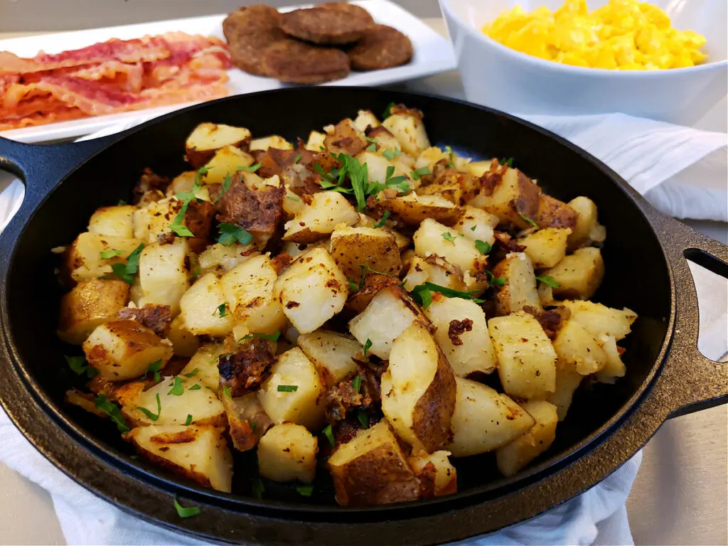 Greek Seasoned Home Fried Potatoes garnished with fresh parsley