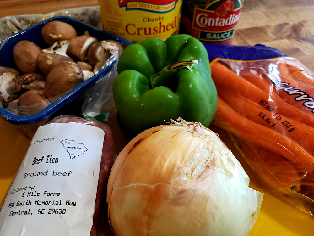 ingredients to make homemade spaghetti sauce recipe. No food processor need, just hand chop.