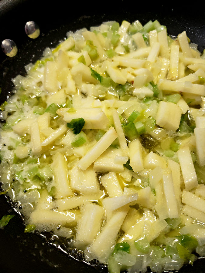 apple, celery, onion and melted butter softening in a skillet