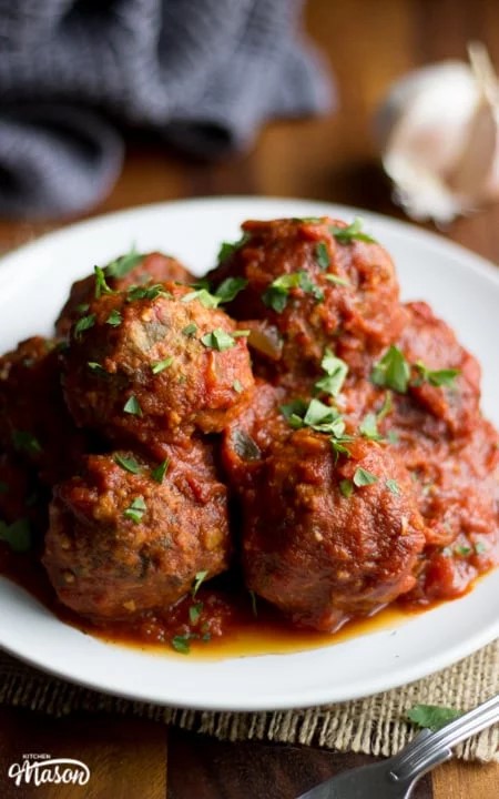 Slow Cooker Meatballs on a plate garnished with parsley