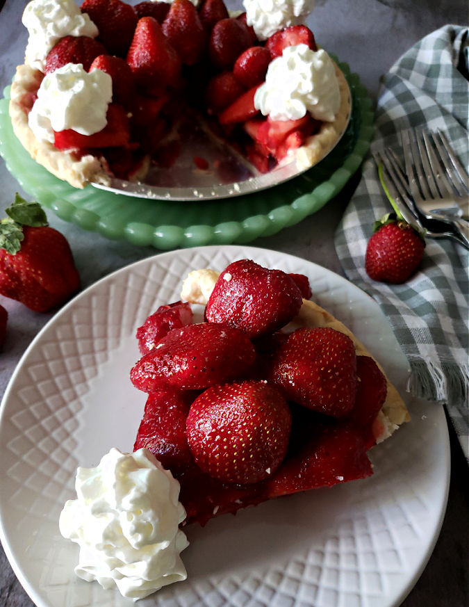 Delicious fresh strawberry pie with whipped cream