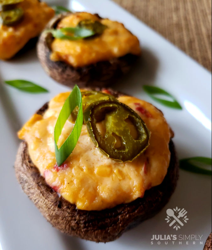 Stuffed Portobello Mushrooms with Palmetto cheese grilled and served on a white platter