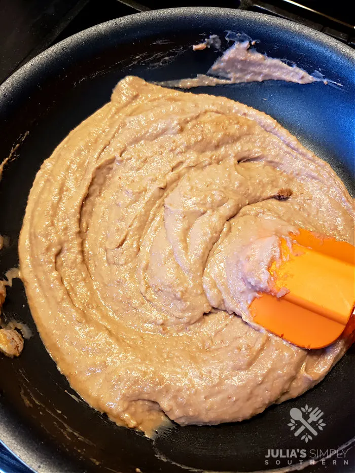 Best ever creamy restaurant style refried beans in a skillet