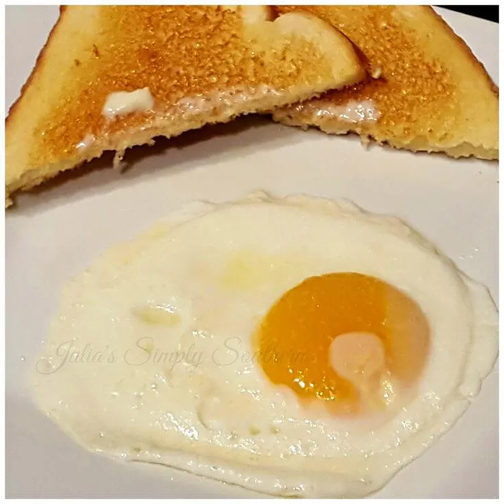 sunny side up egg on a plate with toast