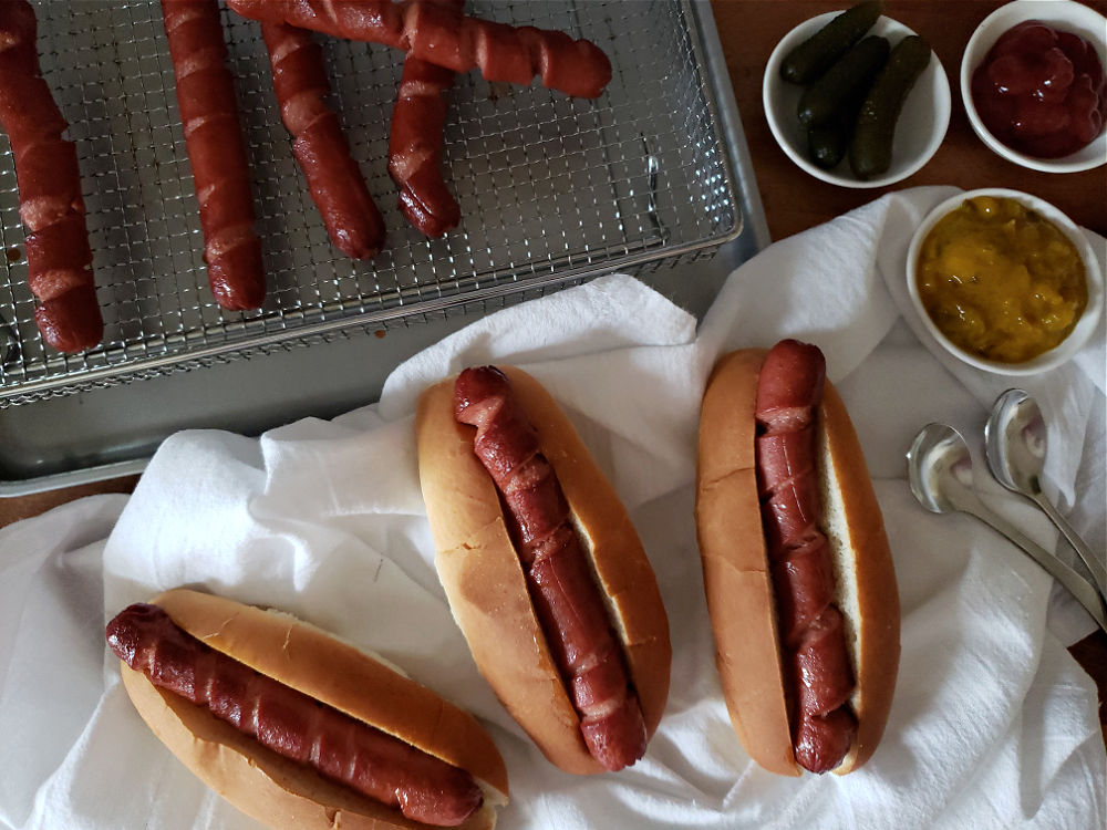 Perfect air fryer hot dogs served with buns and toppings for an easy meal