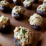 Easy Sausage Stuffed Mushrooms on a 1/4 sheet baking pan with parmesan panko topping