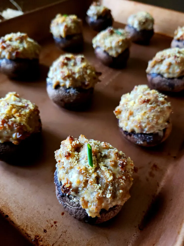 Easy Sausage Stuffed Mushrooms on a 1/4 sheet baking pan with parmesan panko topping