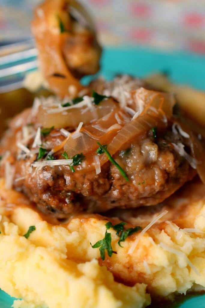 Salisbury Steak on top of mashed potatoes