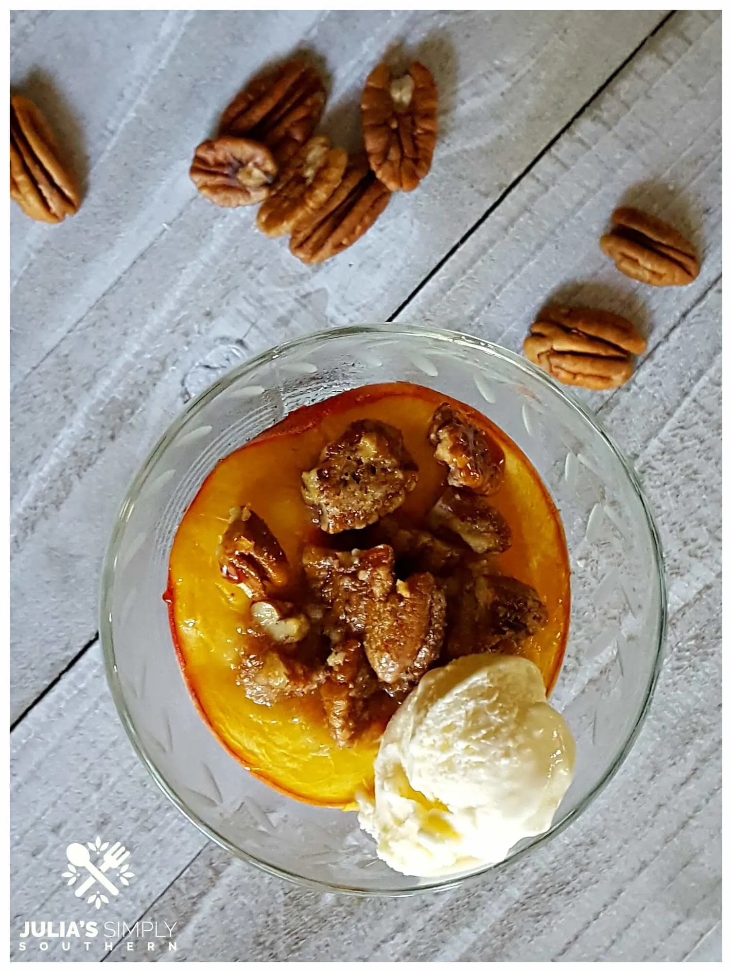 Fresh bourbon peaches baked dessert with ice cream and pecans