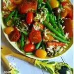 Easy Green Bean and Tomato Salad on a vintage yellow platter with beautiful salad utensils from Italy