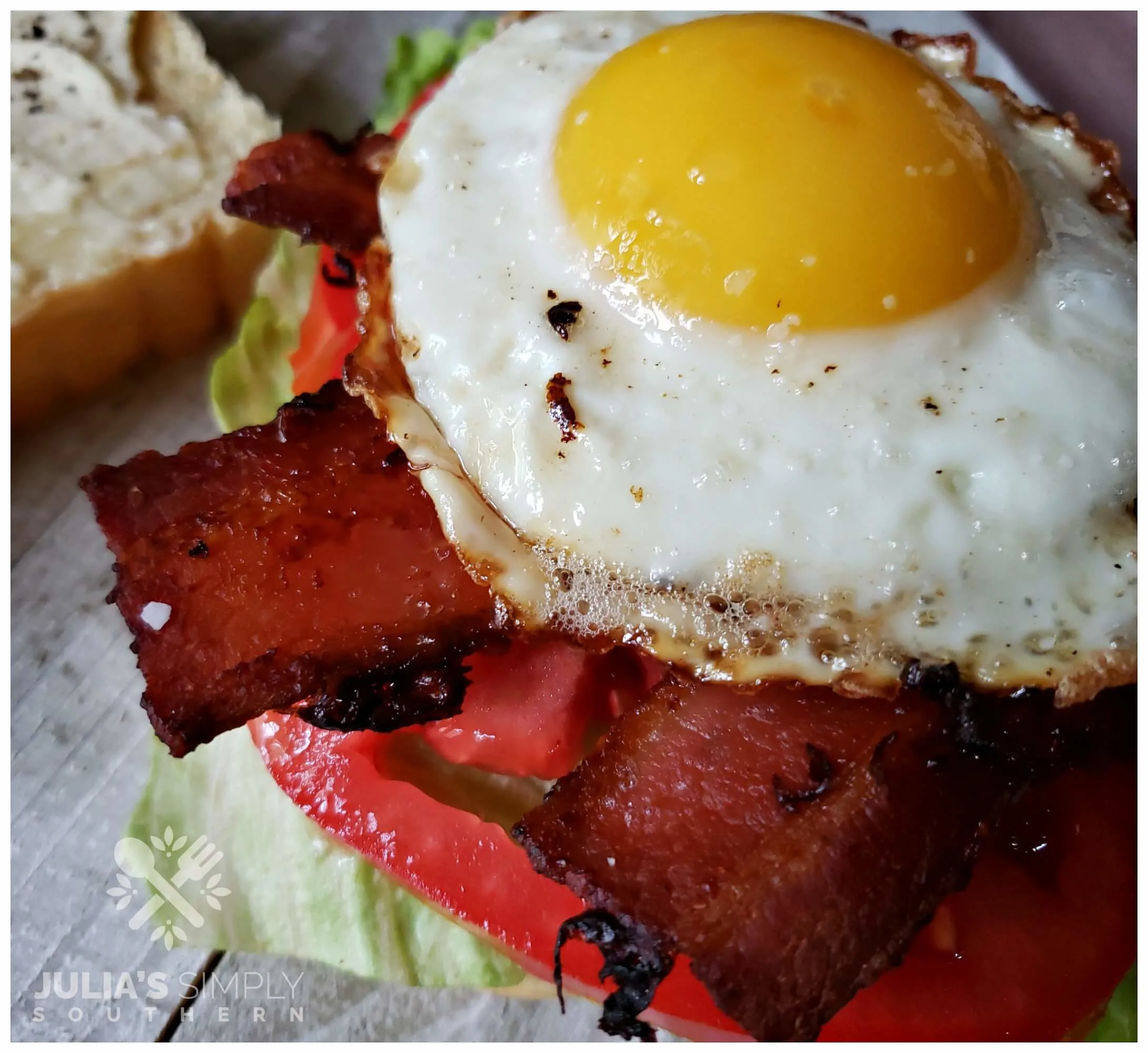 Ultimate bacon, lettuce and tomato with egg and cheese sandwich. 