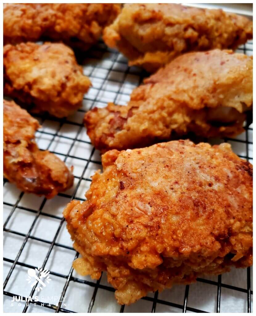 Hot fried chicken on a cooling rack
