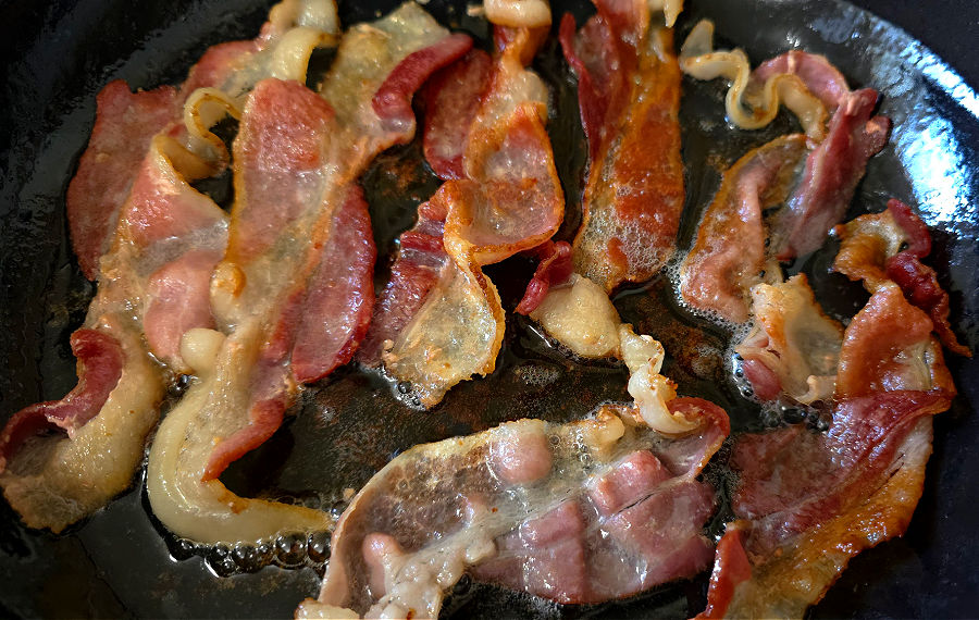 bacon frying in a skillet