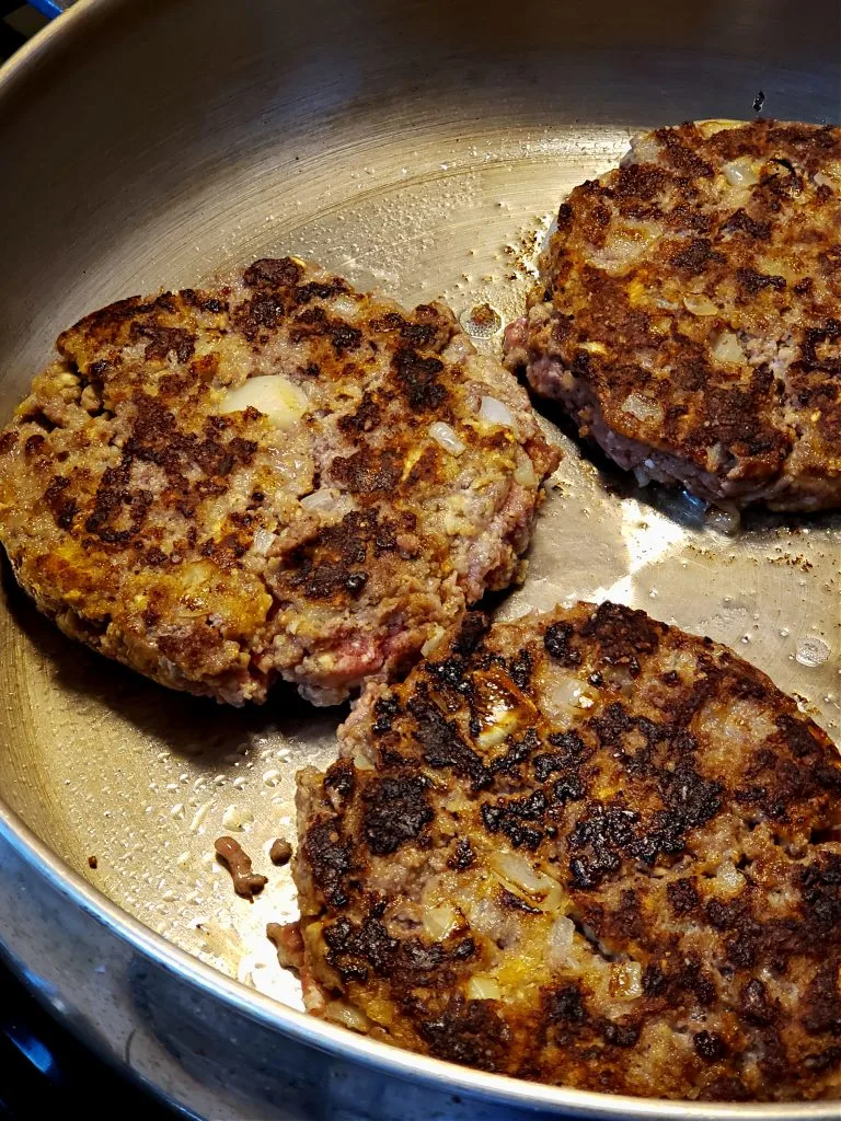 Cooking Southern Salisbury Steak recipe in a stainless skillet