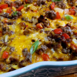 Hash Brown Breakfast Casserole with sausage, eggs, cheese, onions and bell peppers in a Pioneer Woman baking dish
