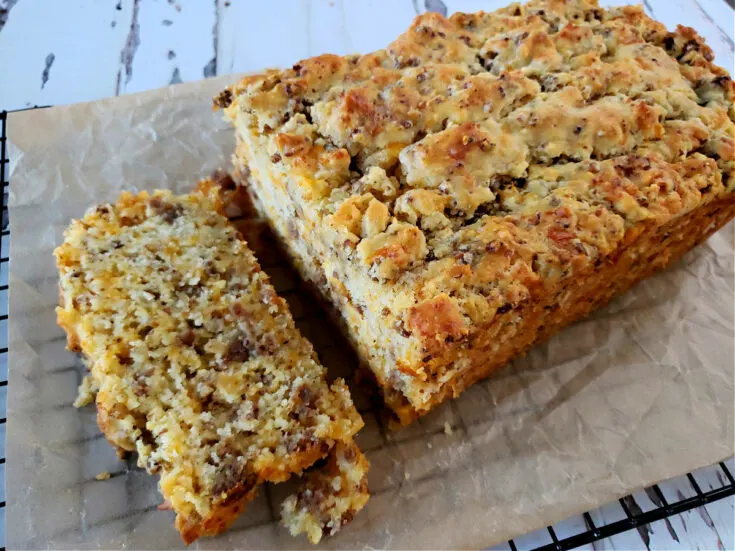 Sausage Bread on parchment paper and a cooling rack