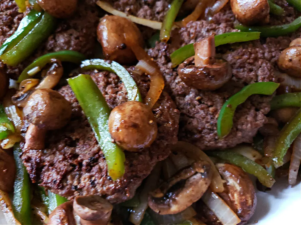 Juicy Hamburger Steaks served on a white platter