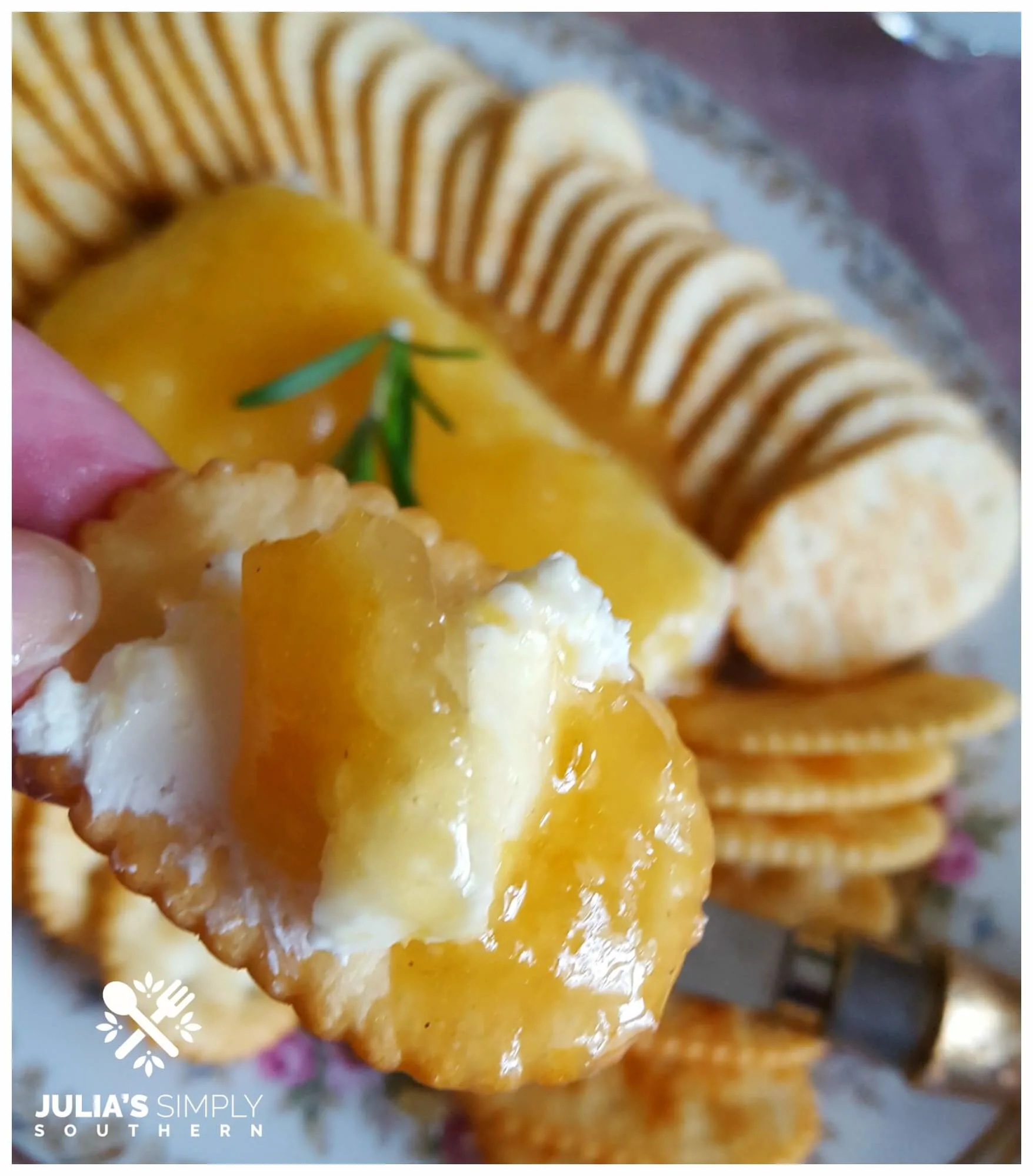 Cream Cheese on a cracker topped with Jezebel Sauce