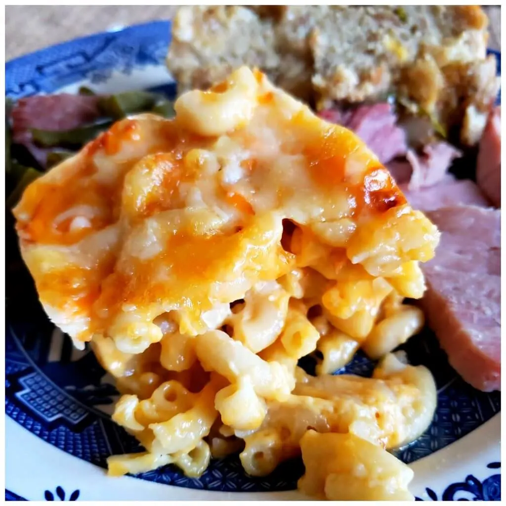 Plate with Southern Macaroni and Cheese served with baked ham and cornbread dressing