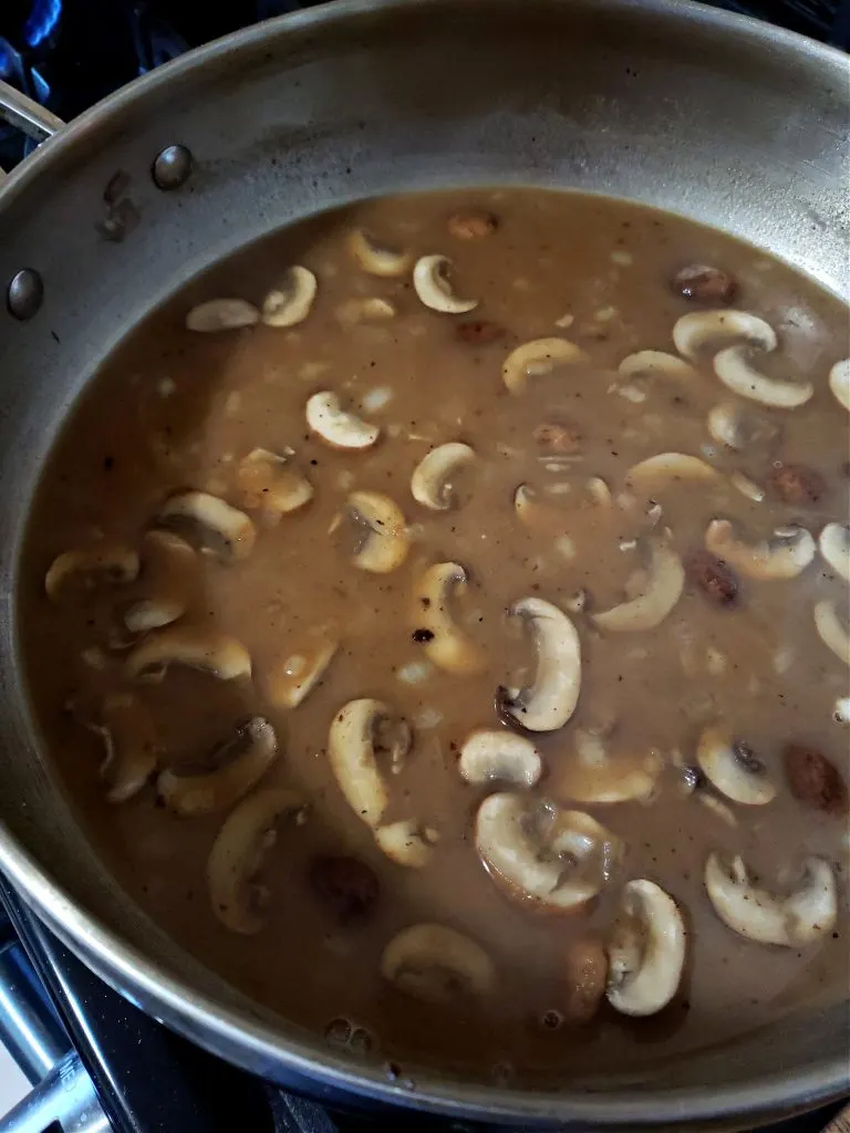 Mushroom gravy simmering for southern Salisbury steak recipe