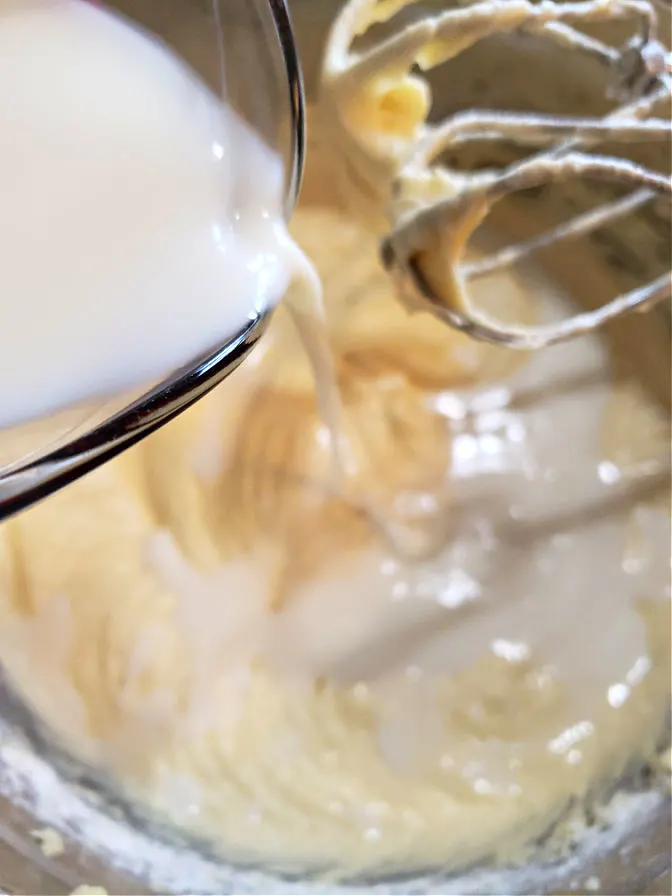 Adding milk to cake batter