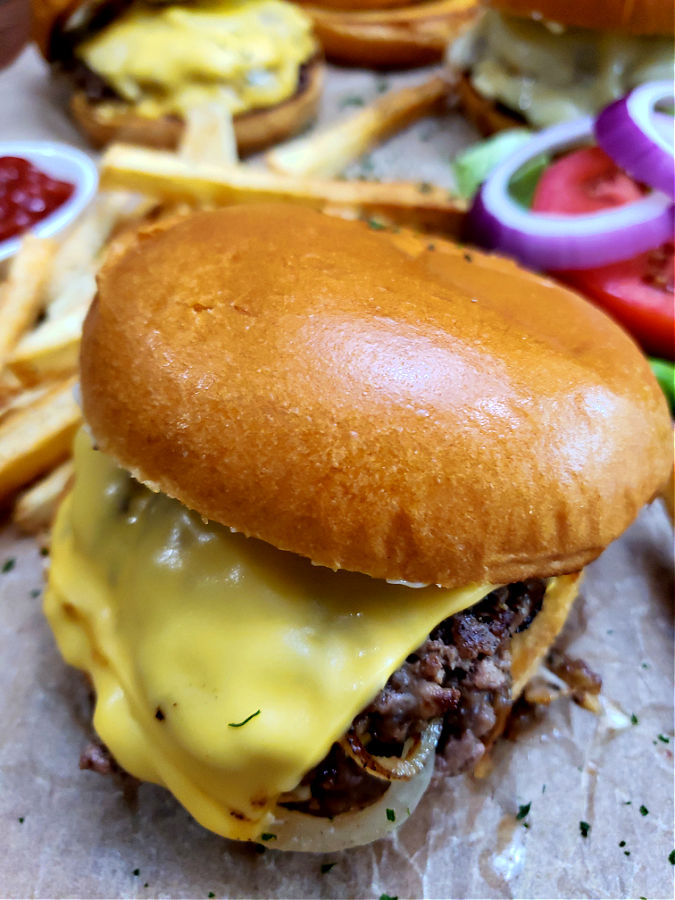 Home cooked smash burgers served up with fries and favorite burger toppings on toasted Brioche buns